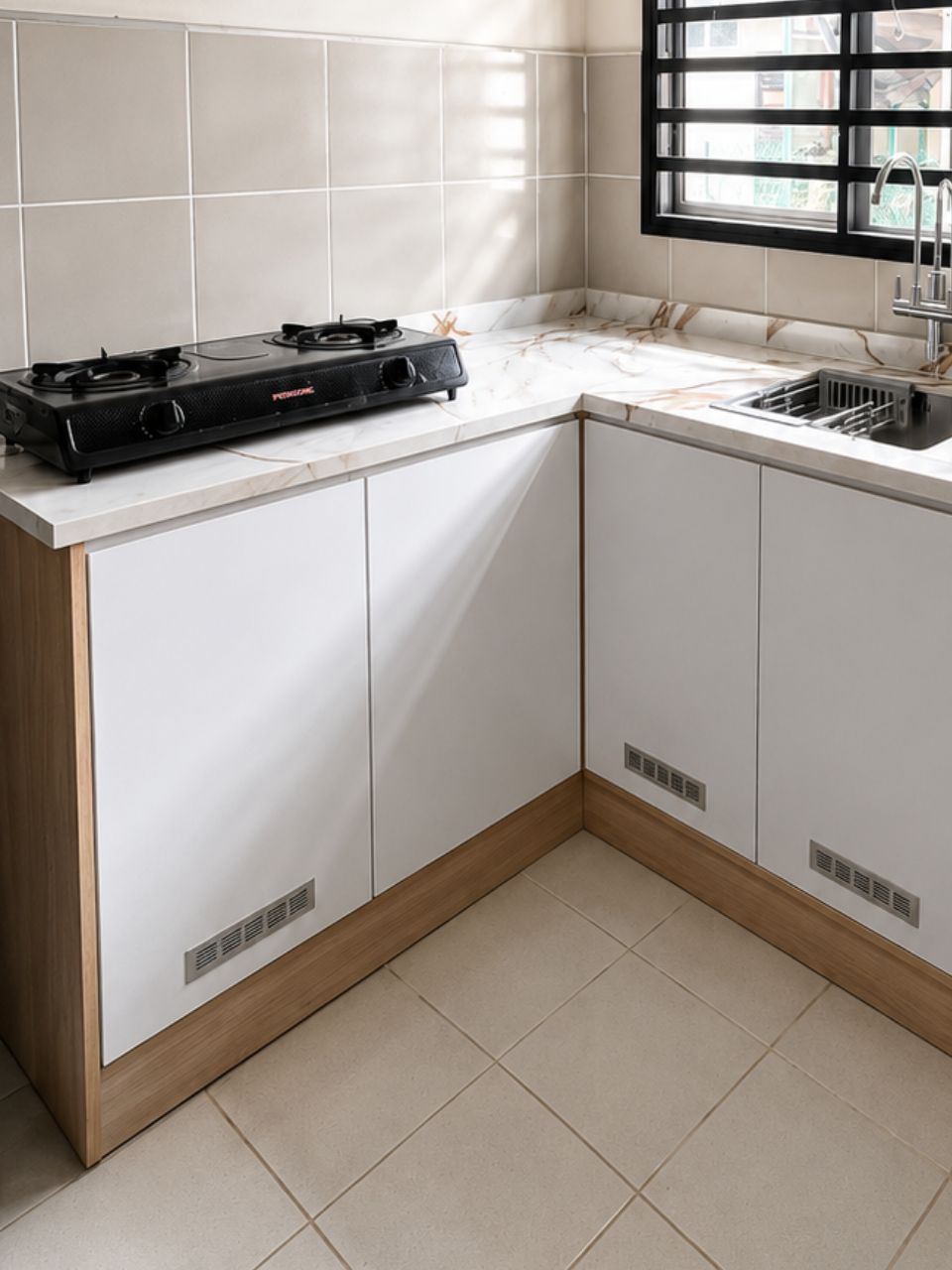 L-shaped kitchen with marble-look countertop, Sri Damai Jaya